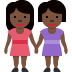 👭🏿 women holding hands: dark skin tone display on Twitter